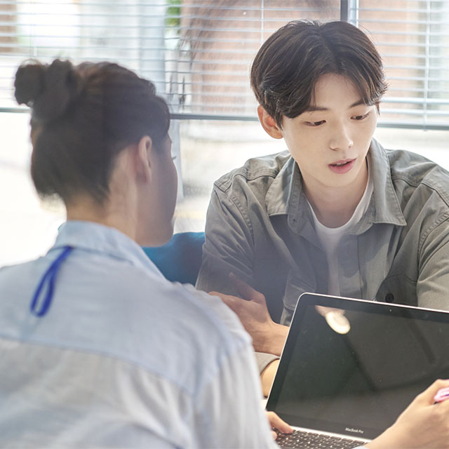 Two students collaborating on a project